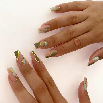 Green-pink stiletto nails with luxury graffiti art