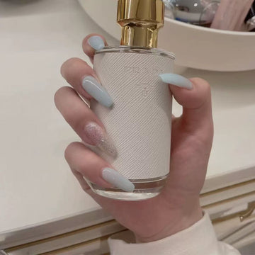 Light blue nails with glossy finish