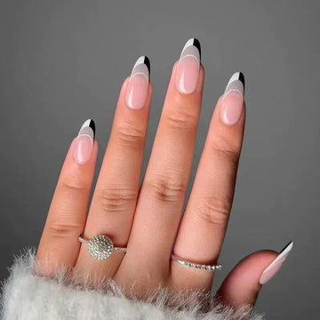 Pink stiletto nails with black edge details