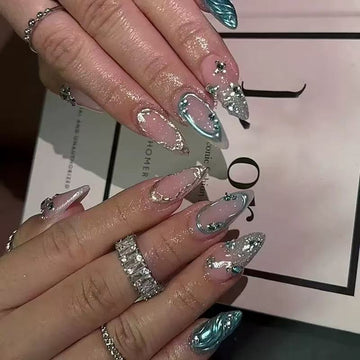 Pink-and-blue glitter stiletto nails with patterns