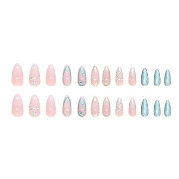 Pink-and-blue glitter stiletto nails with patterns