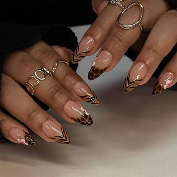 Nude nails with gold glitter accents