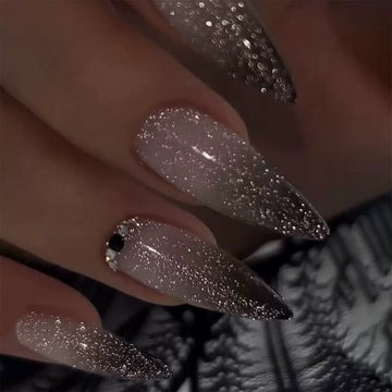 Silver glitter stiletto nails with glossy texture