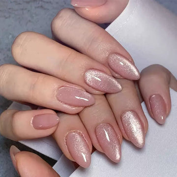 Nude nails with subtle glitter accents