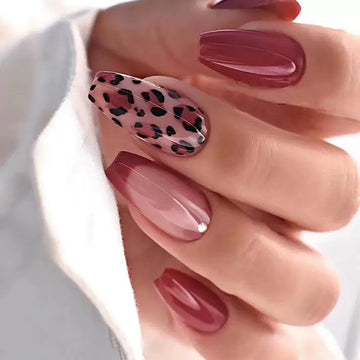 Burgundy nails with leopard print decor