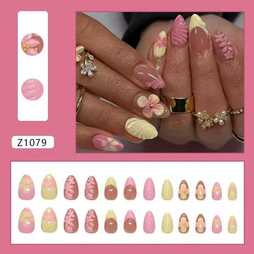 Pink-and-yellow nails with floral and glitter decor