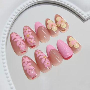 Pink-and-yellow nails with floral and glitter decor