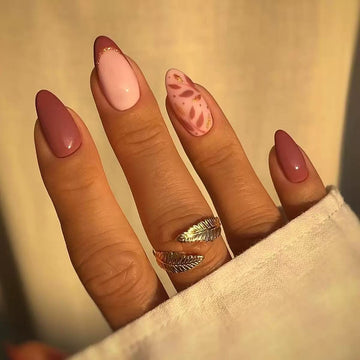 Pink stiletto nails with subtle glitter details