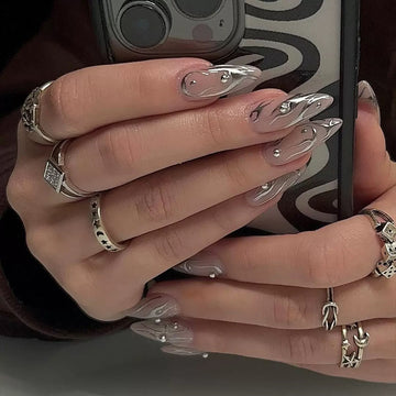 Black-and-white stiletto nails with glitter patterns