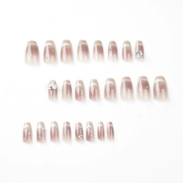 Nude nails with subtle glitter accents