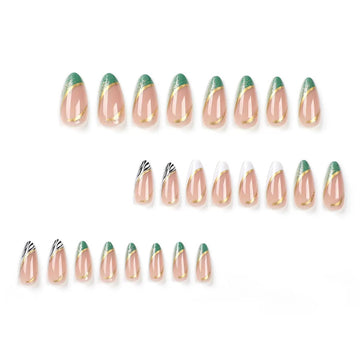 Nude nails with green-and-gold decor accents