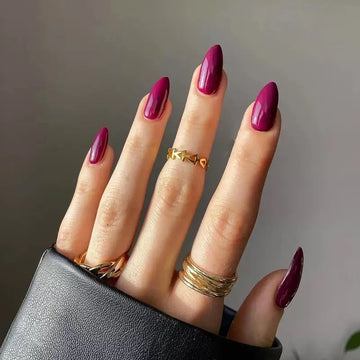 Deep purple nails with glossy finish