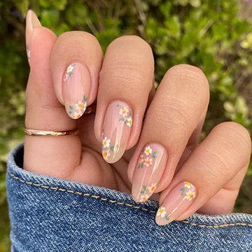 Nude nails with glitter floral decor